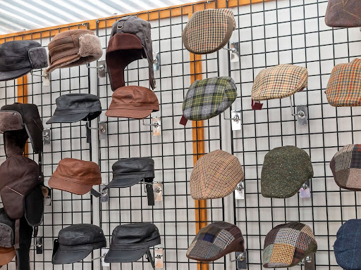 hanging hats is a very commonly used gridwall display idea 