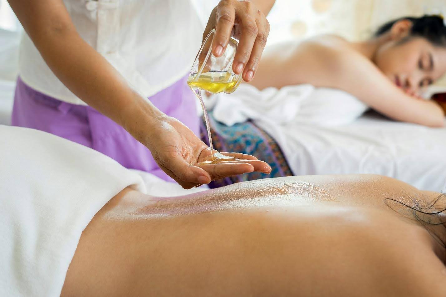 Customers enjoying massage at a spa 