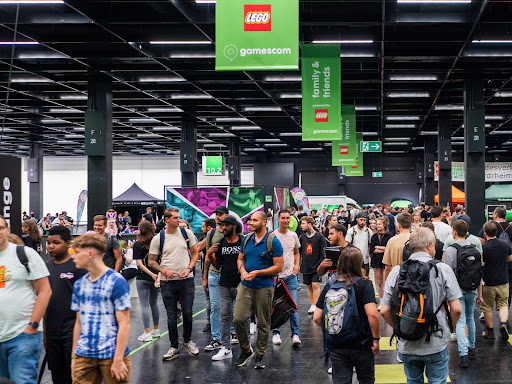 Groups of people navigate through trade show displays