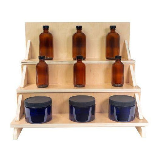 spa retail products organized on wooden countertop step display